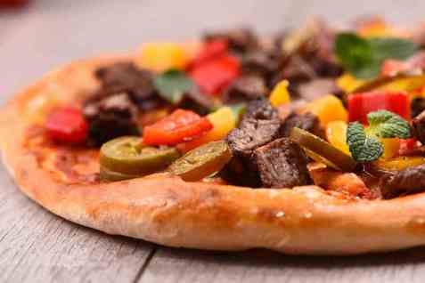 Bilde av Pizzabunn grunndeig. Bilde av Pizzabunn grunndeig.